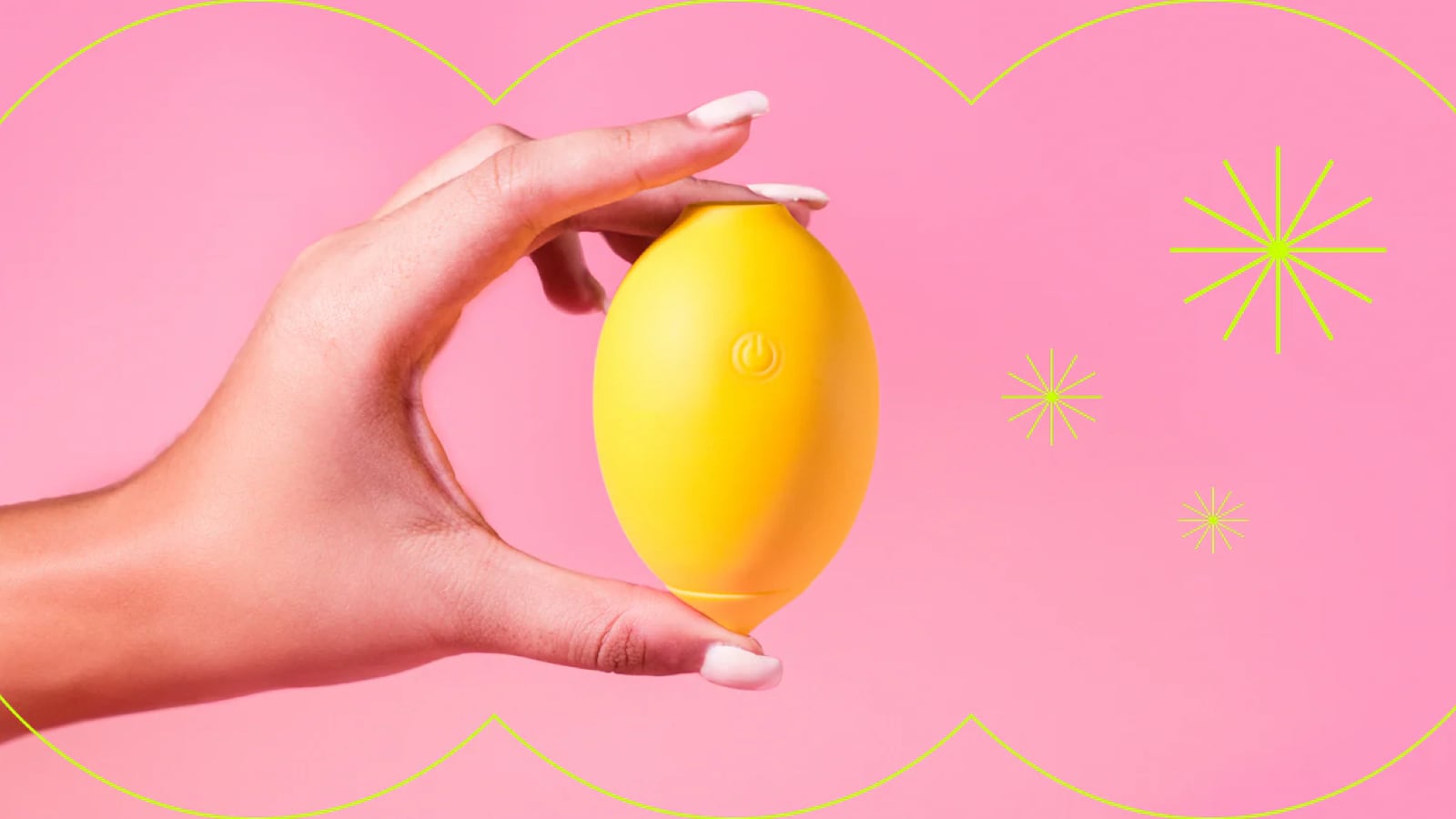 Hand holding a yellow lemon-shaped clitoral massager from Nancy against a pink background.