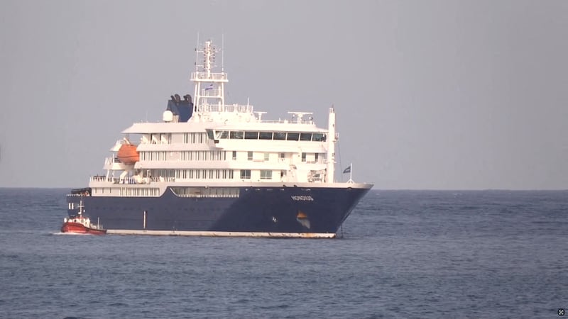 A boat beside cruise ship MV Hondius, hit by Hantavirus, anchored off Cape Verde port, on the day sick passengers were evacuated by boat from the cruise ship, in Praia Port, Cape Verde, in this screengrab obtained from a video, May 5, 2026.