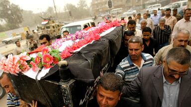 cheats/2009/04/26/saddams-allies-left-out-in-iraq/iraq-bombings-casket-carry_qhlpdx