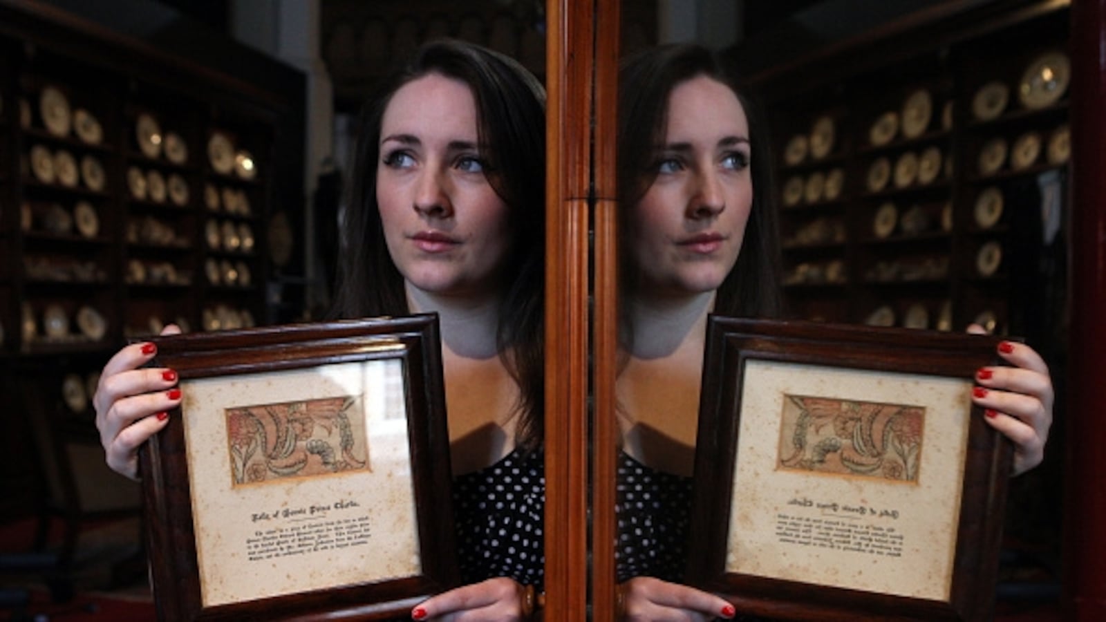 Staff member Theo Burrell holds a fragment of curtain from the bed of Bonnie Prince Charlie which is valued at £500-£700 and is to be auctioned at Lyon & Turnbull Fine Antique sale in Edinburgh. (Photo by David Cheskin/PA Images via Getty Images)