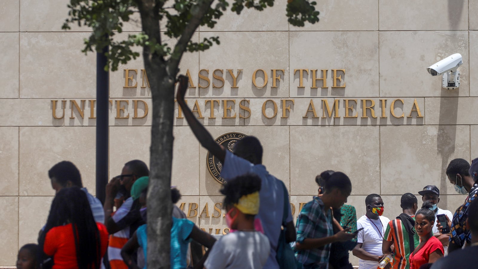 Haitians gather outside the U.S. Embassy