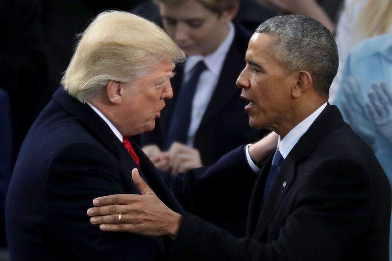 President Barack Obama (R) congratulates U.S. President Donald Trump