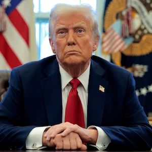 President Donald Trump talks to reporters from the Resolute Desk in the Oval Office at the White House on January 30, 2025 in Washington, DC.