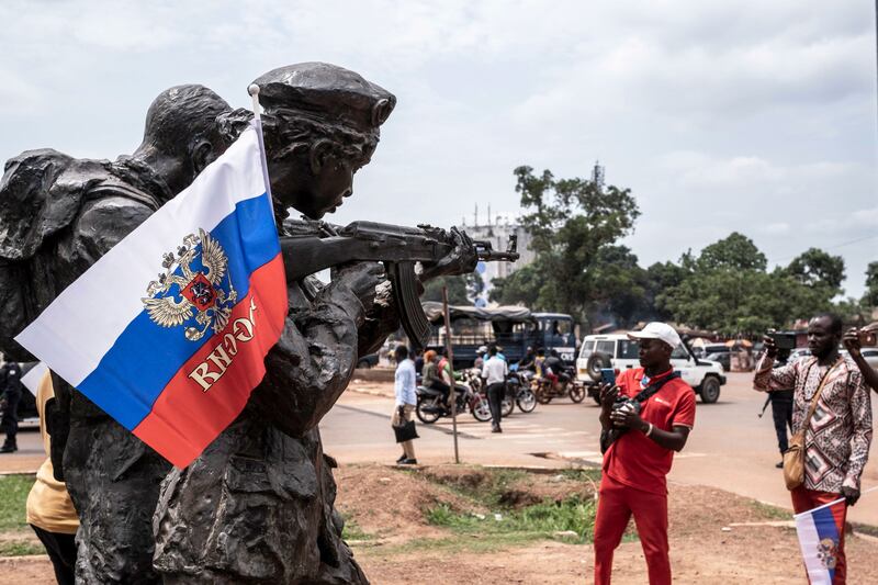 A photograph of a Russian flag with the emblem of Russia on hang on the monument of the Russian instructors in Bangui, on March 22, 2023 during a march in support of Russia's presence in the Central African Republic.