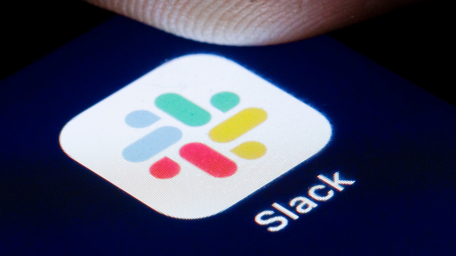 The logo of Instant Messaging Service Slack is shown on the display of a smartphone on April 22, 2020 in Berlin, Germany.