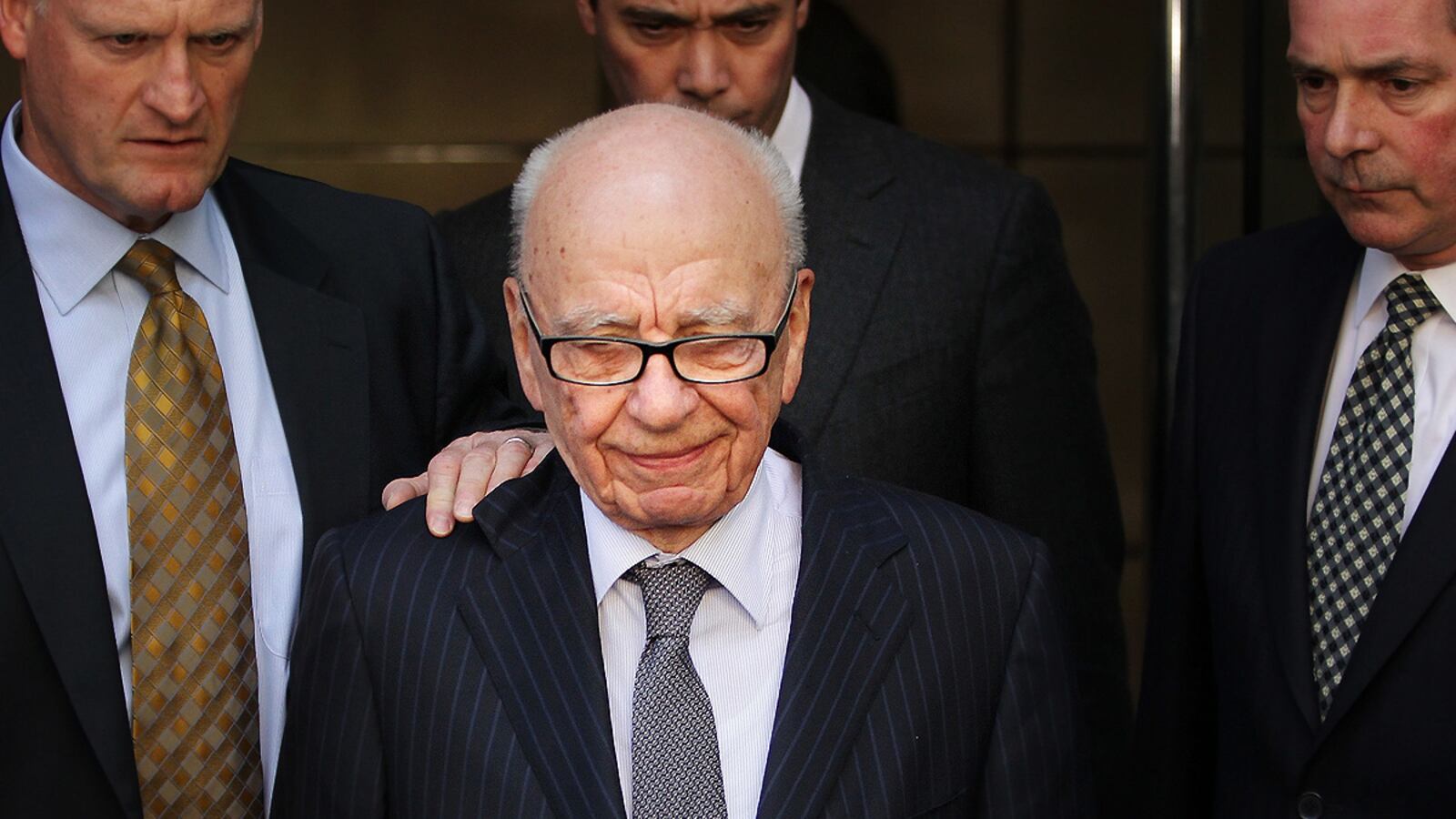 articles/2012/01/19/rupert-murdoch-pays-compensation-to-37-victims-of-phone-hacking/murdoch-court-cheat_mwgs07