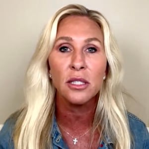 Tucker Carlson speaks to Marjorie Taylor Greene.