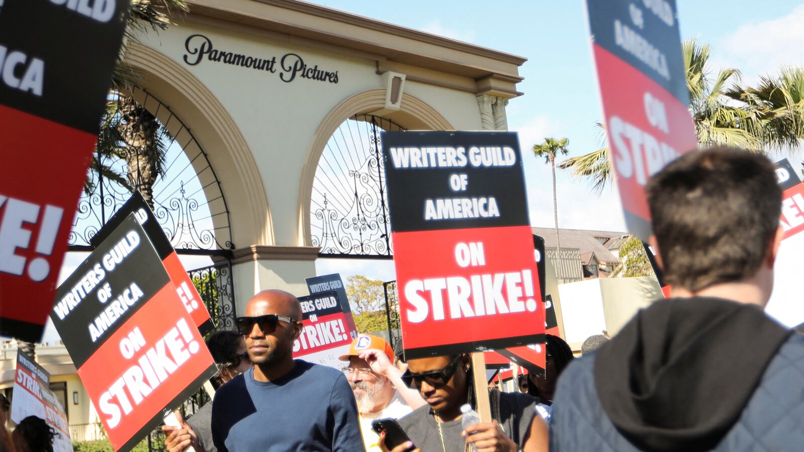 Workers and supporters of the Writers Guild of America protest at a picket line outside Paramount Studios