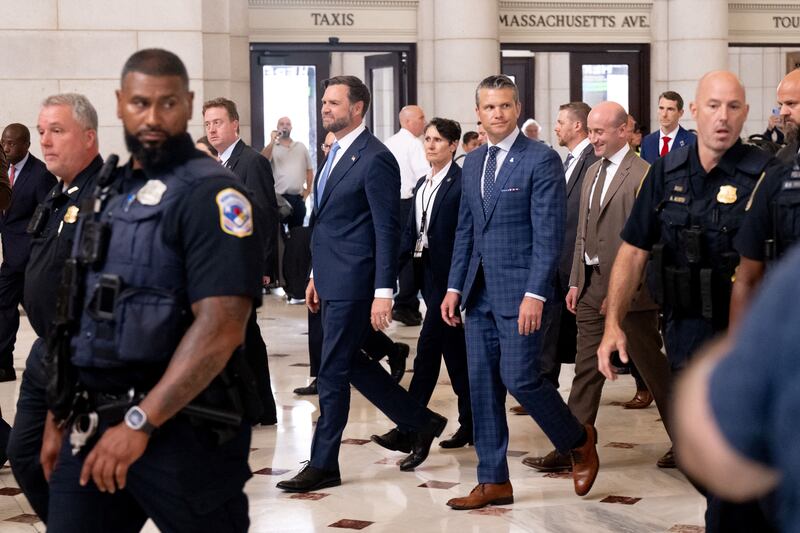 Vice President JD Vance, Defense Secretary Pete Hegseth and White House Deputy Chief of Staff Stephen Miller react to protesters at Union Station in Washington, DC, August 20, 2025.