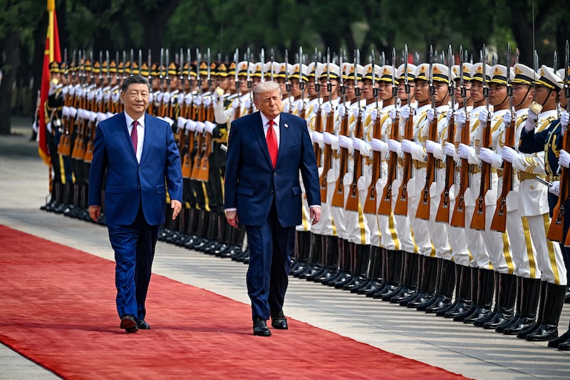 U.S. President Donald Trump reviews the troops with the President of the People’s Republic of China Xi Jinping, in Beijing, China, May 14, 2026, during a trip focused on trade, regional security, and strengthening bilateral ties between the world’s two largest economies. Kenny Holston/Pool via REUTERS