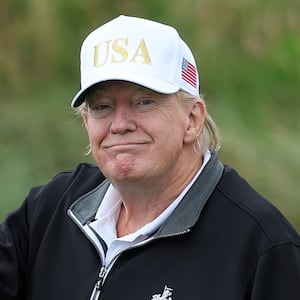 BALMEDIE, SCOTLAND - JULY 29: U.S. President Donald Trump holds a driver after teeing off during the opening of his new golf course at his Trump International Golf links resort on July 29, 2025 in Balmedie, Scotland. President Trump is visiting Scotland in a trip that’s part-vacation, part-work, as he stayed at his Trump Turnberry golf course, followed by Trump International Golf Links in Aberdeenshire, between July 25 to 29. (Photo by Jeff J Mitchell/Getty Images)