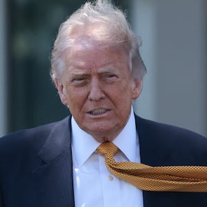 President Donald Trump walks ahead of departing the White House for Joint Base Andrews en route to Beijing, China, in Washington, D.C., U.S., May 12, 2026.