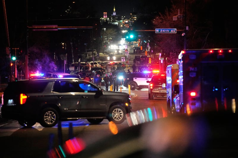 Law enforcement at the scene of a reported shooting Wednesday, Jan. 14, 2026, in Minneapolis.
