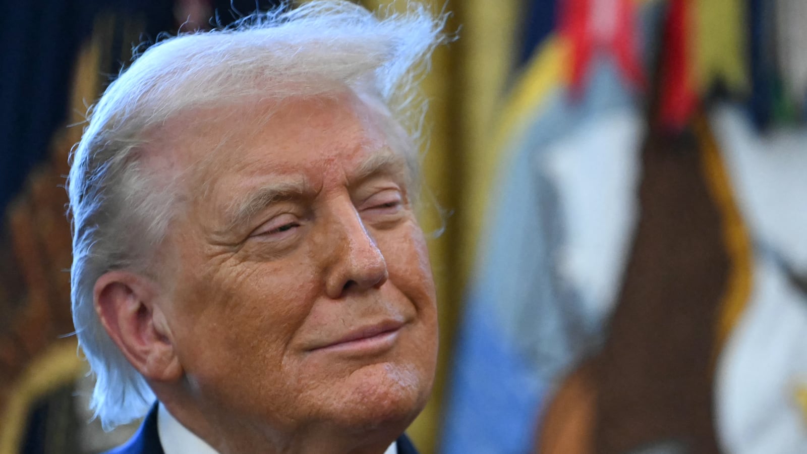 US President Donald Trump looks on during a Mexican Border Defense Medal presentation in the Oval Office of the White House in Washington, DC, on December 15, 2025.