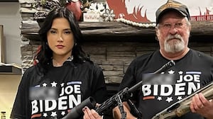 Beni Rae Harmony posing with a gun.