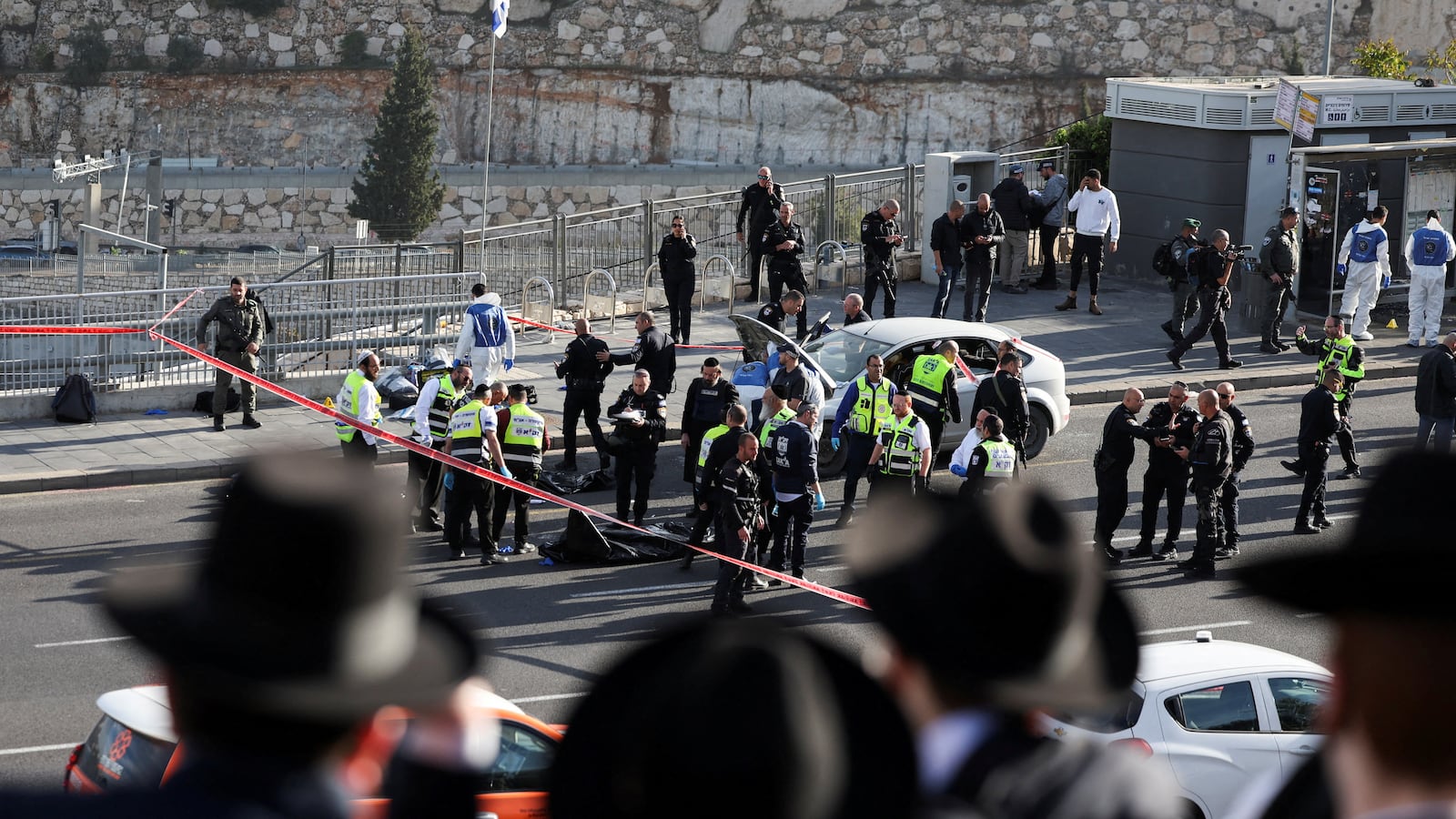 Israeli officials work at the scene of a violent incident in Jerusalem November 30, 2023.