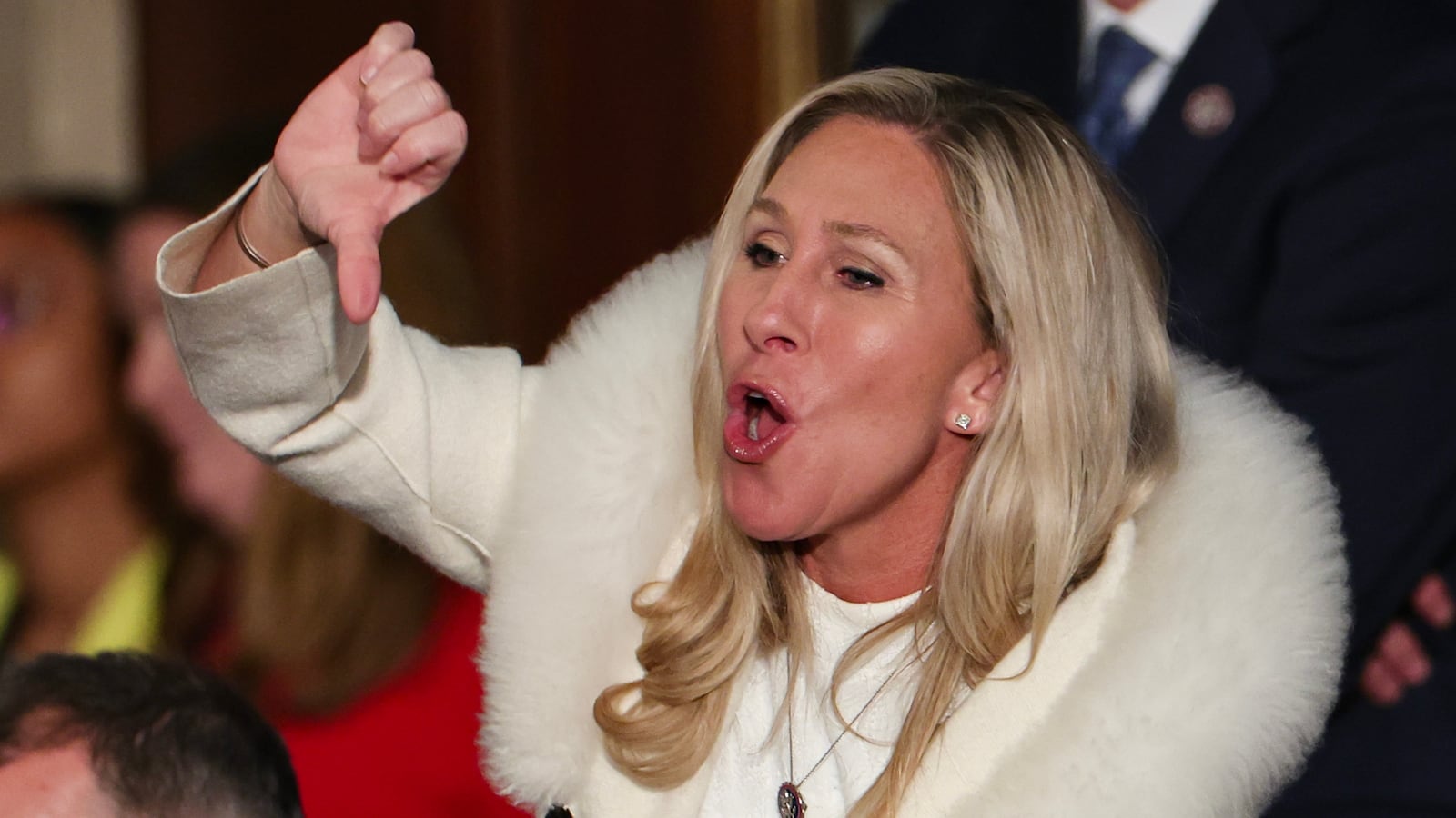 Marjorie Taylor Greene (R-GA) gives a thumbs down during President Joe Biden's State of the Union address.