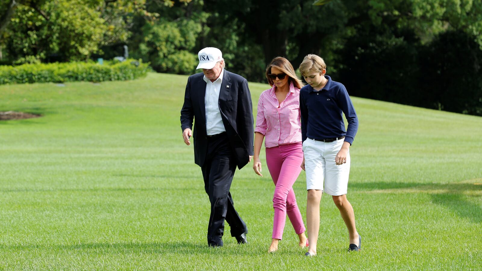 Donald Trump pictured with his wife Melania Trump and their son Barron in 2017.