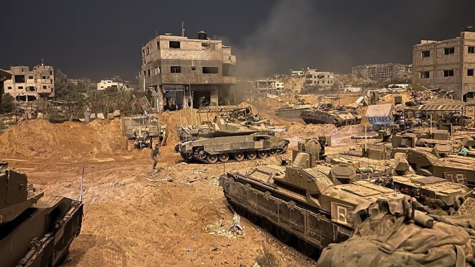 Israeli tanks roll into a war-torn Gaza City.