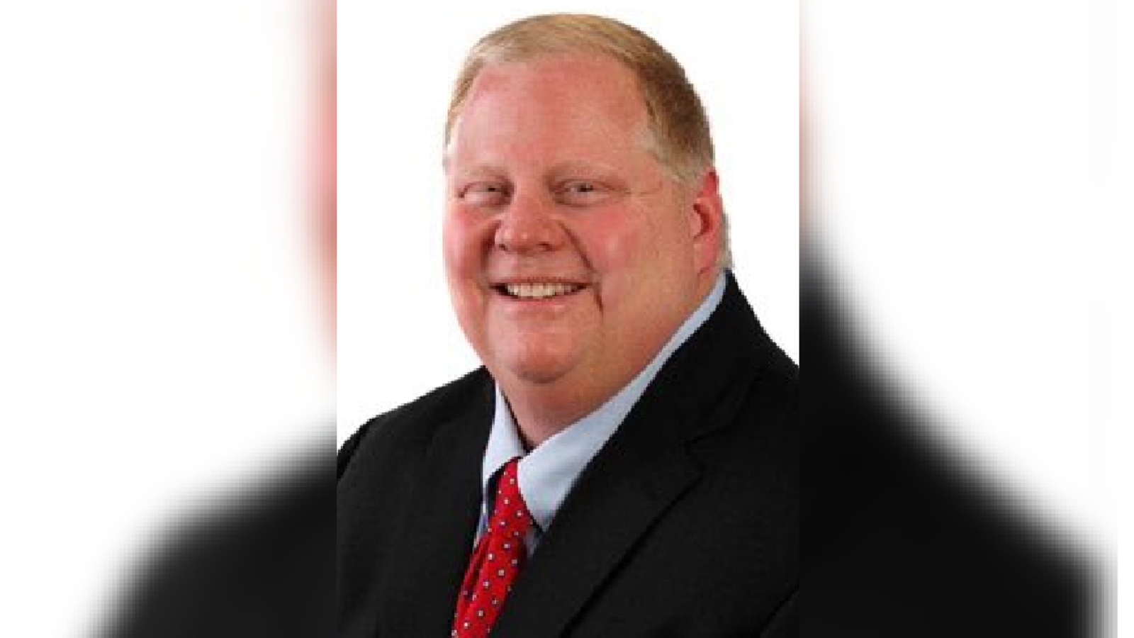 David ‘Red’ Worrall smiles in a headshot.