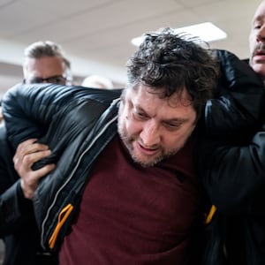 ST. PAUL, MINNESOTA - JANUARY 27: A person is subdued after attempting to attack Rep. Ilhan Omar (D-MN) during a town hall meeting at the Urban League Twin Cities facility on January 27, 2026 in Minneapolis, Minnesota. A person holding a syringe charged Omar's podium while she spoke to community members. Protests and demonstrations continue around Minneapolis in the aftermath of the killings of Alex Pretti and Renee Nicole Good by federal law enforcement.  (Photo by Brandon Bell/Getty Images)