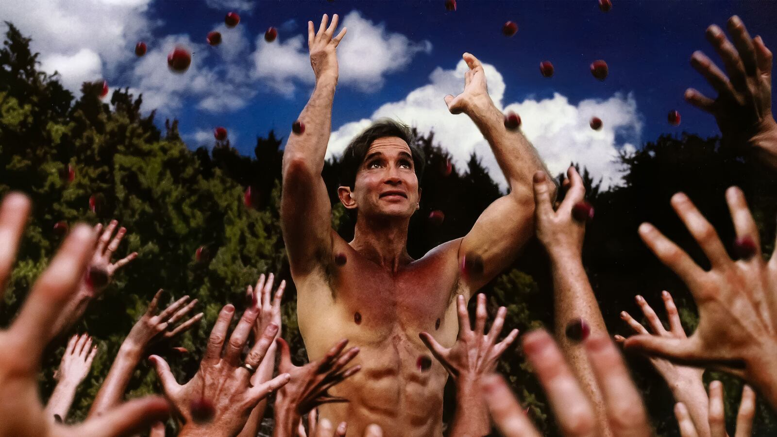 A photo including a still from the docuseries How to Become A Cult Leader on Netflix.