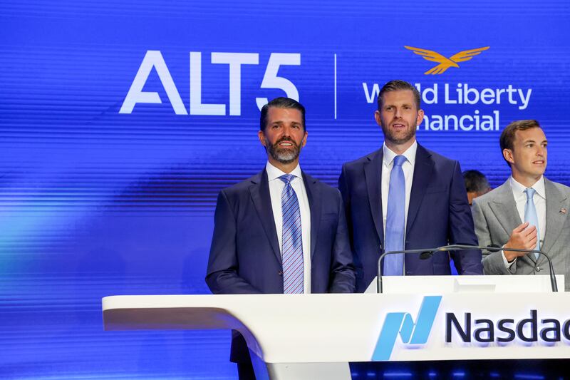 Eric Trump (center), the newly appointed ALT5 Board Director of World Liberty Financial, is joined by his brother and ALT5 Board Observer Donald Trump Jr. (left), and Zach Witkoff, Co-Founder and CEO of World Liberty Financial to mark the $1.5B partnership between World Liberty Financial (WLFI) and ALT5 Sigma with the ringing of the NASDAQ opening bell on August 13, 2025 in New York City.