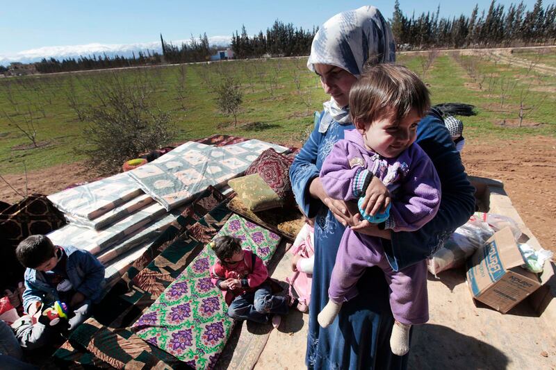 articles/2012/03/08/syrians-flee-across-lebanon-border-as-regime-forces-finish-cleaning-operation/syria-homs-refugees-paul_xuylwz