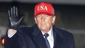 President Donald Trump waves to the media after landing aboard Air Force One on March 1, 2026 at Joint Base Andrews, Maryland.