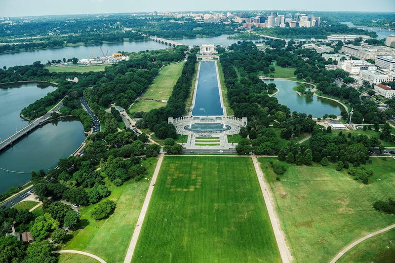 Authorities responded to what appeared to be a large tracing of the term 8647 into the grounds of the National Mall in Washington, D.C., June 11, 2026. A Reuters photographer captured the emerging image from atop the Washington Monument on the Mall's grass shortly before authorities arrived. The arrangement of the numbers was clearly an attempt to show 8647, though the 4 was not fully formed. Federal prosecutors on other occasions have said the term could indicate a threat to President Trump, the 47th U.S. president. REUTERS/Nathan Howard REFILE - QUALITY REPEAT     TPX IMAGES OF THE DAY