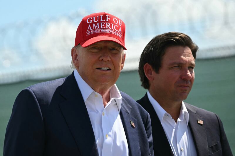 Donald Trump and Florida Governor Ron DeSantis tour a migrant detention center, dubbed "Alligator Alcatraz," located at the site of the Dade-Collier Training and Transition Airport in Ochopee, Florida on July 1, 2025.