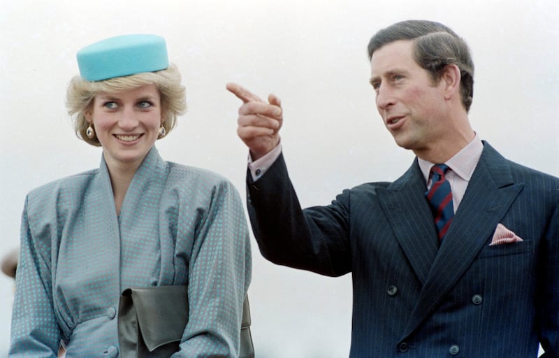 Prince Charles points out something in the crowd to Diana, Princess of Wales, during a walkabout in Nanaimo, British Columbia, Canada, on May 1, 1986, as part of a royal tour of British Columbia.