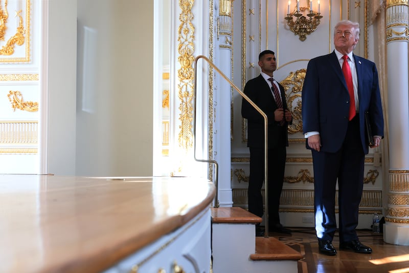 President Donald Trump waits to speak during a road dedication ceremony at Mar-a-Lago on January 16, 2026 in Palm Beach, Florida.