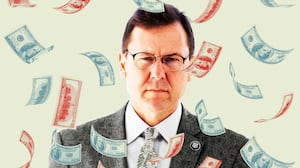 Tom Kean with money falling around him