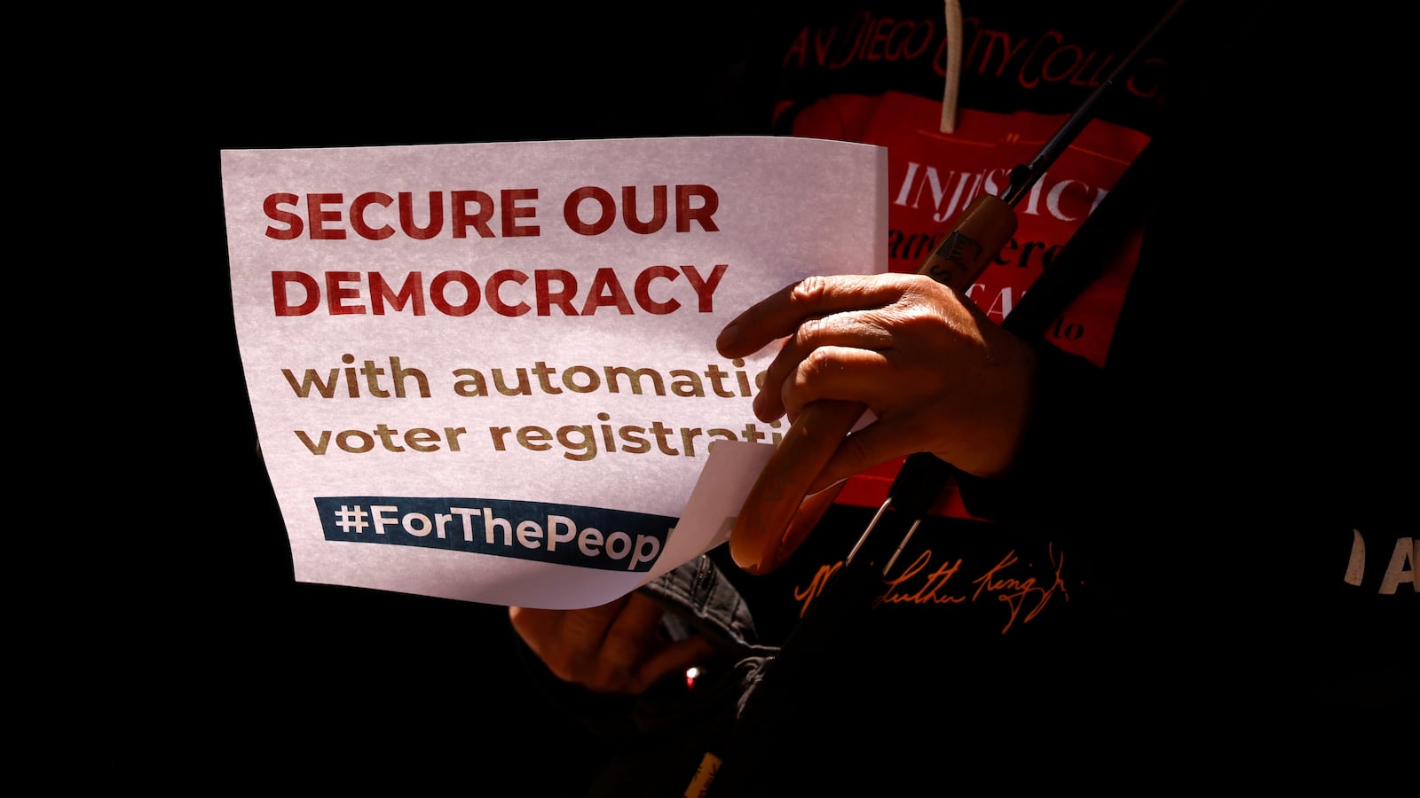 2021-04-05T203054Z_1072622571_RC2WPM9SFJU3_RTRMADP_3_USA-VOTE-PROTEST_fjvyh6