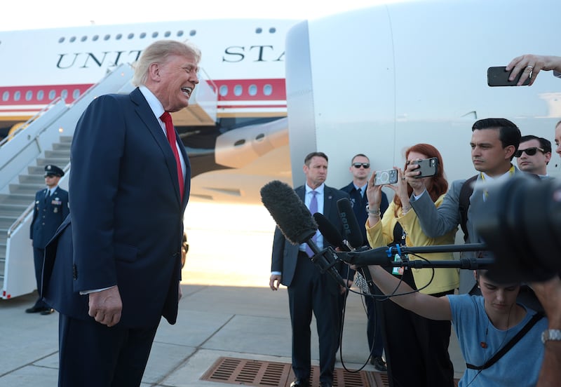 CHARLOTTE, NORTH CAROLINA - SEPTEMBER 16: U.S. President Donald Trump talks with members of the media after walking off Air Force One at the Charlotte Douglas International Airport on September 16, 2026 in Charlotte, North Carolina. Trump is traveling to North Carolina to campaign with Republican Senate nominee, former RNC Chairman Michael Whatley. (Photo by Anna Moneymaker/Getty Images)