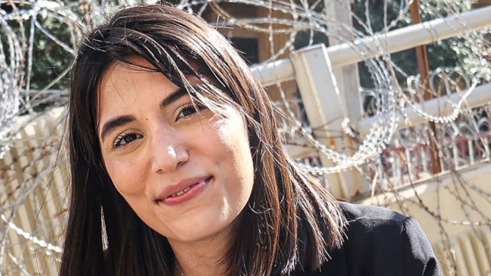 Lebanese Al-Mayadeen tv reporter Farah Omar looks on during the coverage of a demonstration in Beirut on April 18, 2023.