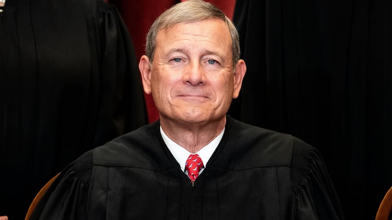 Chief Justice John Roberts sits during a group photo of the Justices at the Supreme Court in Washington, DC on April 23, 2021.