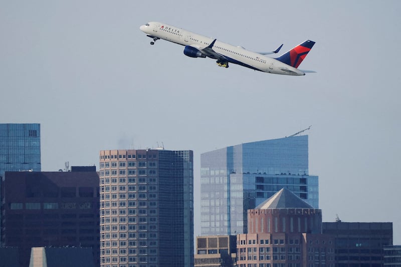 FILE PHOTO: A Delta Airlines flight takes off from Logan International Airport, as airlines cancelled flights at 40 major airports after the government imposed an unprecedented cut to air travel, citing air traffic control safety concerns because of a record-setting government shutdown, in Boston, Massachusetts, U.S., November 7, 2025.   REUTERS/Brian Snyder/File Photo/File Photo