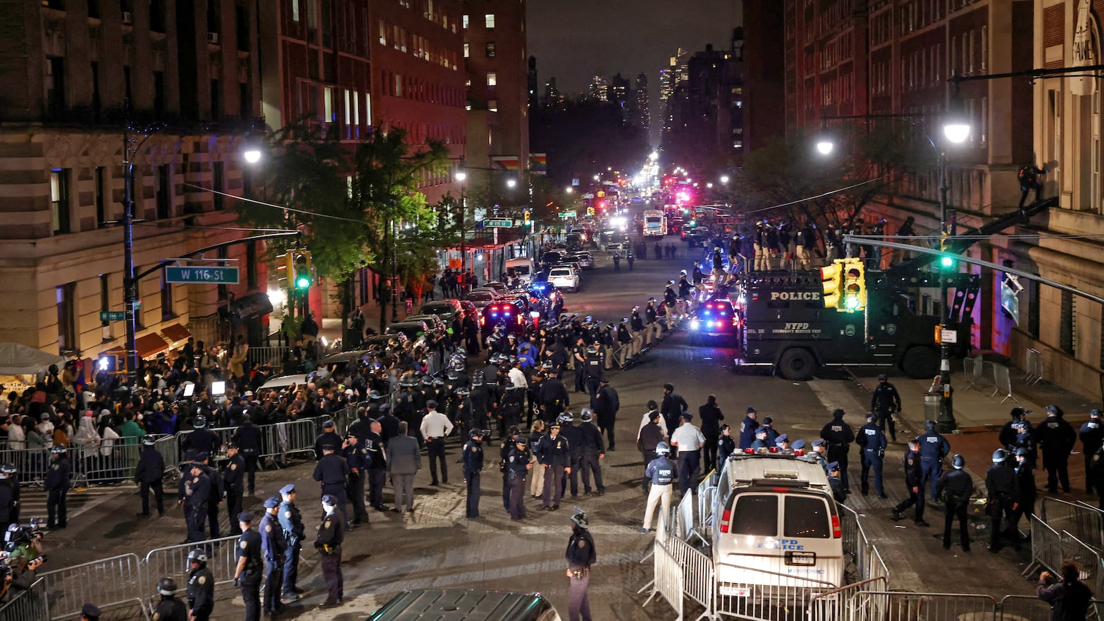 Police use a special vehicle to enter Hamilton Hall which was occupied by protesters, as other officers enter the campus of Columbia University