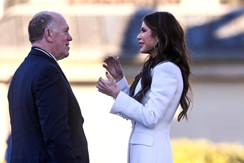 US Secretary of Homeland Security Kristi Noem (R) and White House 'border czar' Tom Homan speak