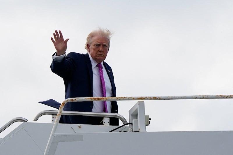 U.S. President Donald Trump waves as he boards Air Force One at Palm Beach International Airport in West Palm Beach, Florida, U.S., March 29, 2026.