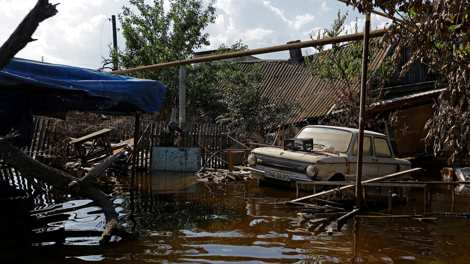 A view shows a Soviet-made Zaporozhets car in a street after floodwaters receded in the town of Hola Prystan in the Kherson region, Russian-controlled Ukraine, June 16, 2023.