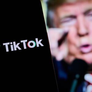 TikTok logo in front of a picture of President-elect Donald Trump.