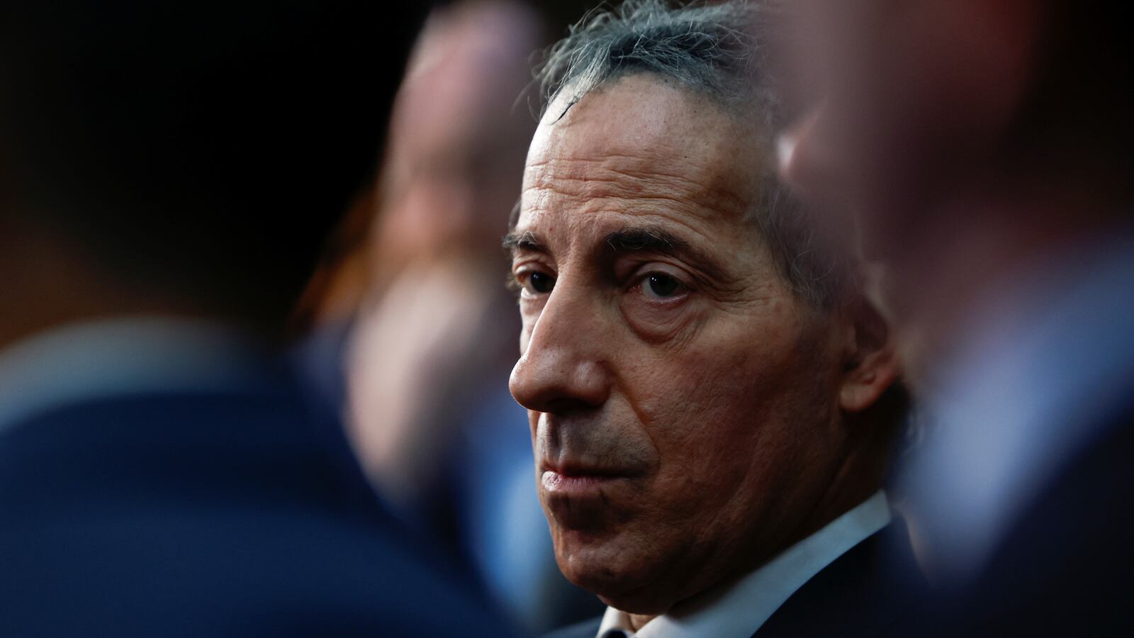 Jamie Raskin’s face photographed between other politicians