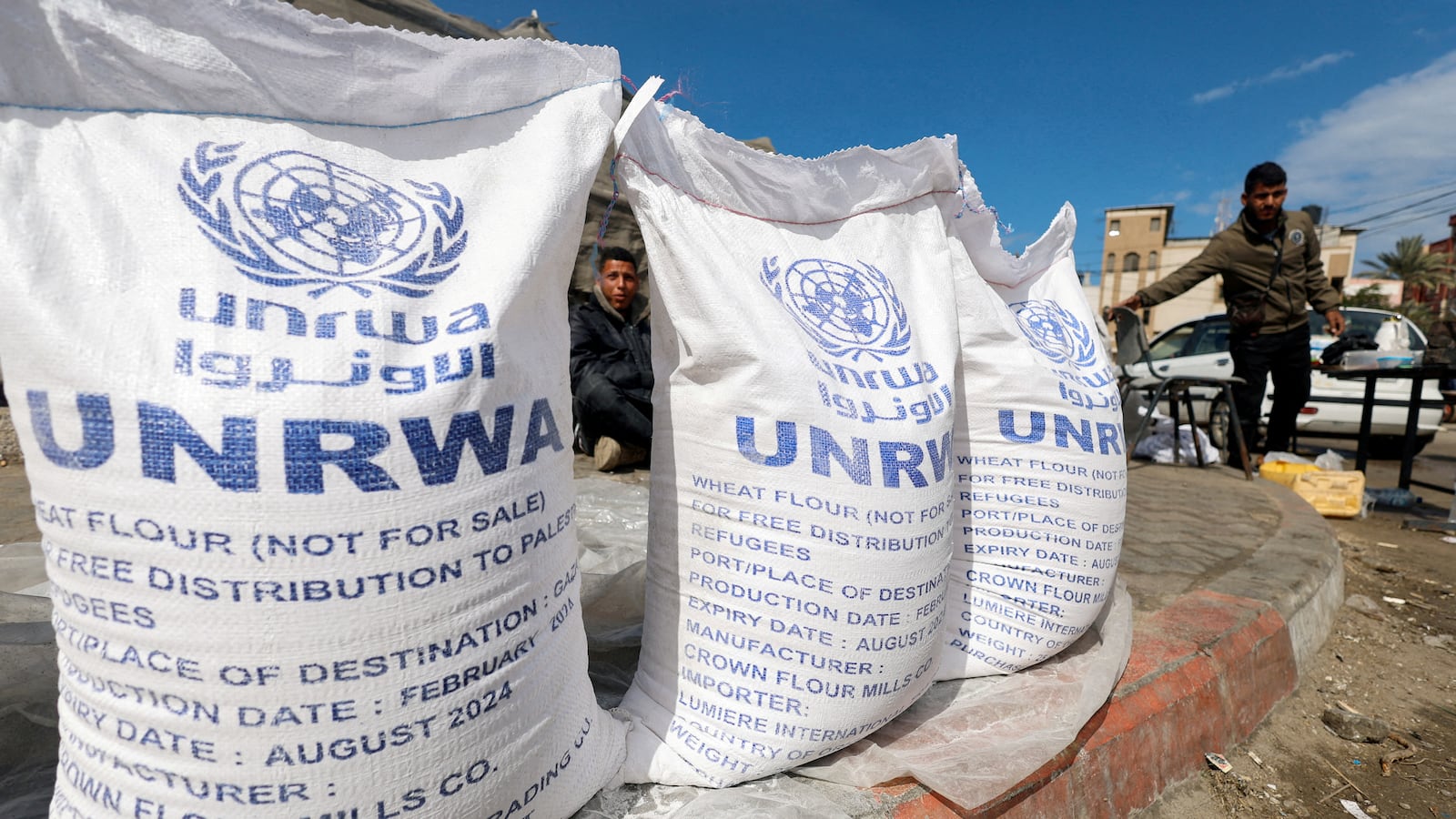 Displaced Palestinians wait to receive United Nations Relief and Works Agency (UNRWA) aid, amid the ongoing conflict between Israel and the Palestinian Islamist group Hamas,in Rafah, in the southern Gaza Strip, March 7, 2024.