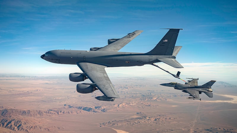 An F-16 Fighting Falcon, assigned to the 64th Aggressor Squadron, conducts air-to-air refueling with a KC-135 Stratotanker during U.S. Air Force Weapons School Integration (WSINT) at Nellis Air Force Base, Nevada, Nov. 28, 2022. The U.S. Air Force Weapons School trains tactical experts and leaders to control and exploit air, space and cyber on behalf of the joint force.