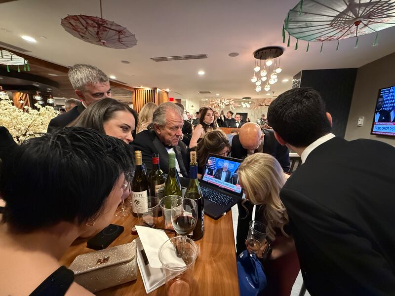 reporters gathered at the bar