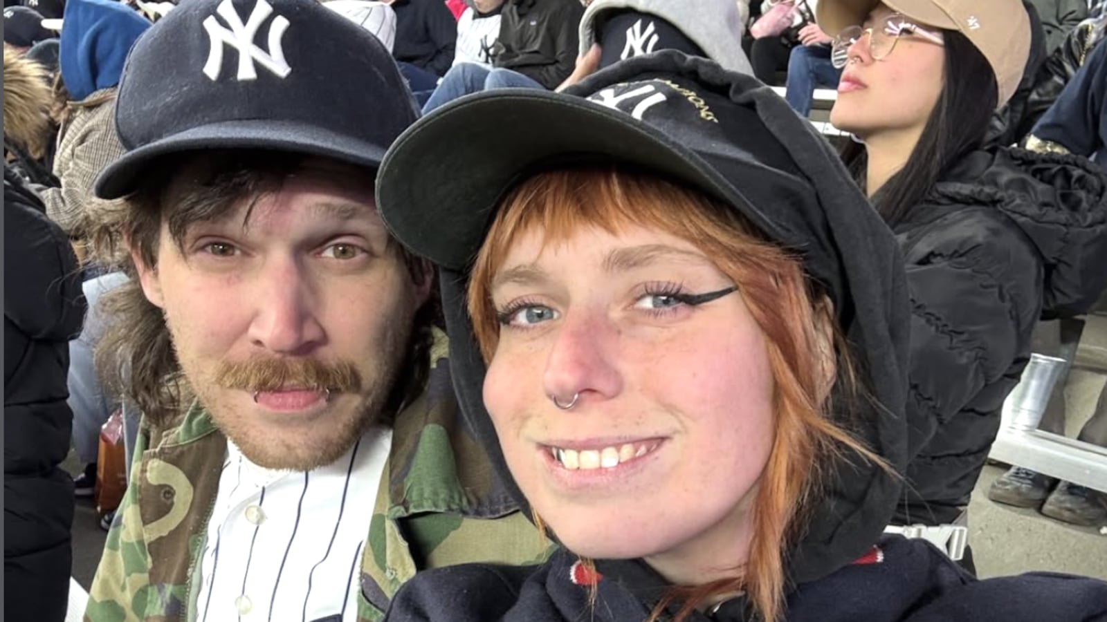 Kaitlyn E. Tracey and her partner at Yankee Stadium posted to Instagram