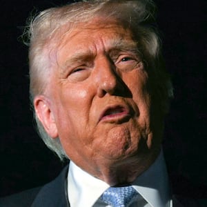 US President Donald Trump speaks with reporters before boarding Air Force One as he departs Palm Beach International Airport in West Palm Beach, Florida, on November 16, 2025. Trump is returning to the White House after spending the weekend at his Mar-a-Lago, Florida, residence.